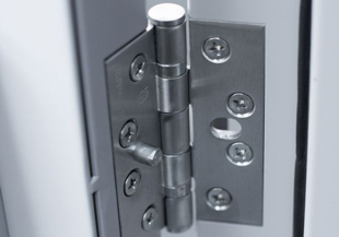 Fire door hinge undergoing maintenance