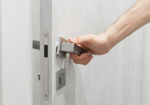 Male hand opens a secure door